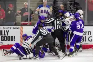 A fight breaks out between the Omaha Mavericks and the Niagara Purple Eagles in the third period during a college hockey match on Friday, October 13, 2023, in Omaha, Nebraska. Photo by John S. Peterson.