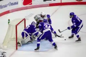 Omaha Mavericks forward Nolan Sullivan (11) shot blocked by Niagara Purple Eagles goaltender Mitchell Day (30) in the third period during a college hockey match on Friday, October 13, 2023, in Omaha, Nebraska. Photo by John S. Peterson.