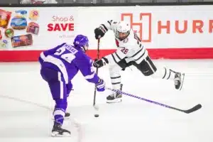Omaha Mavericks forward Jack Randl (28) takes a shot against Niagara Purple Eagles defenseman Josef Mysak (24) in the third period during a college hockey match on Friday, October 13, 2023, in Omaha, Nebraska. Photo by John S. Peterson.