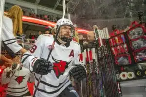 Omaha Mavericks forward Jack Randl (28) runs out on to the ice against the Niagara Purple Eagles before a college hockey match on Friday, October 13, 2023, in Omaha, Nebraska. Photo by John S. Peterson.