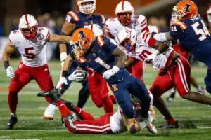 Nebraska Cornhuskers Ty Robinson (9) tackles Fighting Illini wide receiver Isaiah Williams (1) during a college football game in Lincoln, Nebraska, Friday, October 6, 2023. Photo by John Peterson.