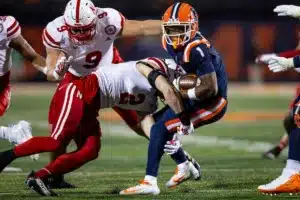 Nebraska Cornhuskers Isaac Gifford (2) tackles Fighting Illini wide receiver Isaiah Williams (1) during a college football game in Lincoln, Nebraska, Friday, October 6, 2023. Photo by John Peterson.