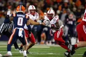 Nebraska Cornhuskers Heinrich Haarberg (10) fakes handing the ball off to Anthony Grant (23) to run in for a touch down against the Illinois Fighting Illini during a college football game in Lincoln, Nebraska, Friday, October 6, 2023. Photo by John Peterson.