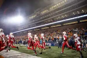 Nebraska Cornhuskers run out on to the filed to take on the Illinois Fighting Illini during a college football game in Lincoln, Nebraska, Friday, October 6, 2023. Photo by John Peterson.