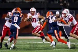 DUPLICATE***Nebraska Cornhuskers Jimari Butler (10)***Nebraska Cornhuskers Heinrich Haarberg (10) runs ball against Illinois Fighting Illini defensive back Xavier Scott (14) during a college football game in Lincoln, Nebraska, Friday, October 6, 2023. Photo by John Peterson.