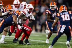 Nebraska Cornhuskers Anthony Grant (23) runs with the ball against Illinois Fighting Illini linebacker Dylan Rosiek (28) during a college football game in Lincoln, Nebraska, Friday, October 6, 2023. Photo by John Peterson.