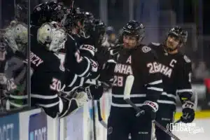 Omaha Maverick forward Jack Randl (28) celebrates his goal with the bench in the third period against the Augustana Vikings during the hockey match on Saturday, November 25, 2023, in Sioux Falls, SD. Photo by John S. Peterson.
