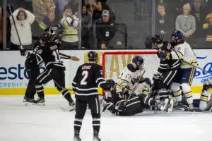 Omaha Maverick defenseman Jacob Guevin (10) (left) celebrates a goal in second period against the Augustana Vikings during the hockey match on Saturday, November 25, 2023, in Sioux Falls, SD. Photo by John S. Peterson.