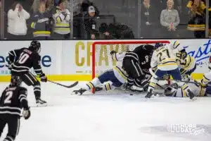 Omaha Mavericks fight for a goal the Augustana Vikings in the second period during the hockey match on Saturday, November 25, 2023, in Sioux Falls, SD. Photo by John S. Peterson.