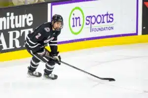 Omaha Maverick defenseman Joaquim Lemay (2) skates with the puck against the Augustana Vikings during the hockey match on Saturday, November 25, 2023, in Sioux Falls, SD. Photo by John S. Peterson.