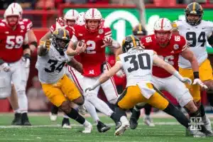 Nebraska Cornhuskers quarterback Chubba Purdy (12) runs for a first down during a against the Iowa Hawkeyes game in Lincoln, NE November 24th 2023. Photo by Eric Francis