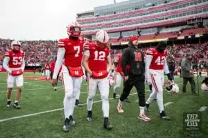 Nebraska Cornhusker quarterback Chubba Purdy (12)  walks off the field with quarterback Jeff Sims (7)  after the loss to Iowa Hawkeyes in the final seconds during the football game on Thursday, November 24, 2023, in Lincoln, Neb. Photo by John S. Peterson.