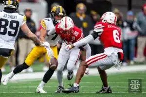 Nebraska Cornhusker defensive back Tommi Hill (31) breaks up a pass to Iowa Hawkeye wide receiver Jacob Bostick (7) in the second quarter during the football game on Thursday, November 24, 2023, in Lincoln, Neb. Photo by John S. Peterson.