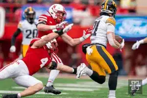 Nebraska Cornhuskers linebacker Luke Reimer (4) and Nebraska Cornhuskers defensive back Isaac Gifford (2) chase down Iowa Hawkeyes wide receiver Kaden Wetjen (21) during a game in Lincoln, NE November 24th 2023. Photo by Eric Francis