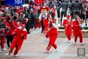 Nebraska Cornhuskers trombone players making race car noises while waiting for the Huskers arrive during the football game against Iowa Hawkeyes on Thursday, November 24, 2023, in Lincoln, Neb. Photo by John S. Peterson.