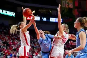 Creighton Bluejay forward Emma Ronsiek (31) drives to the basket against Nebraska Cornhusker guard Jaz Shelley (1) in the fourth quarter during the basketball game on Sunday, November 19, 2023, in Lincoln, Nebraska. Photo by John S. Peterson.