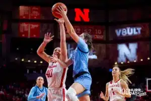 Nebraska Cornhusker guard Kendall Moriarty (15) makes a layup against Nebraska Cornhusker center Alexis Markowski (40) in the fourth quarter during the basketball game on Sunday, November 19, 2023, in Lincoln, Nebraska. Photo by John S. Peterson.