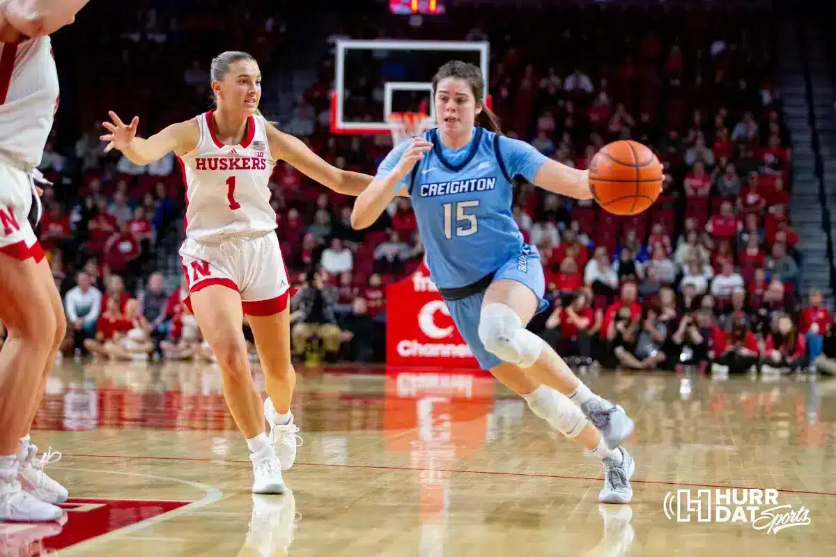 Creighton Bluejay guard Lauren Jensen (15) makes a layup against Nebraska Cornhusker guard Jaz Shelley (1) in the fourth quarter during the basketball game on Sunday, November 19, 2023, in Lincoln, Nebraska. Photo by John S. Peterson.