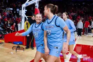 Creighton Bluejay guard Molly Mogensen (21) and Creighton Bluejay forward Emma Ronsiek (31) head back to the lockerroom after their win over the Huskers during the basketball game on Sunday, November 19, 2023, in Lincoln, Nebraska. Photo by John S. Peterson.