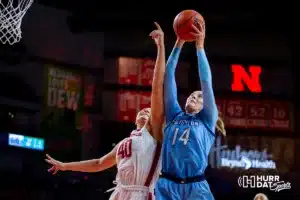 Creighton Bluejay forward Mallory Brake (14) grabs the rebound against Nebraska Cornhusker center Alexis Markowski (40) in the fourth quarter during the basketball game on Sunday, November 19, 2023, in Lincoln, Nebraska. Photo by John S. Peterson.