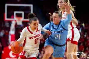 Nebraska Cornhusker guard Darian White (0) drives to the basket against Creighton Bluejay guard Molly Mogensen (21) in the third quarter during the basketball game on Sunday, November 19, 2023, in Lincoln, Nebraska. Photo by John S. Peterson.