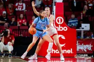 Creighton Bluejay forward Emma Ronsiek (31) drives to the basket against Nebraska Cornhusker forward Jessica Petrie (12) during the basketball game on Sunday, November 19, 2023, in Lincoln, Nebraska. Photo by John S. Peterson.