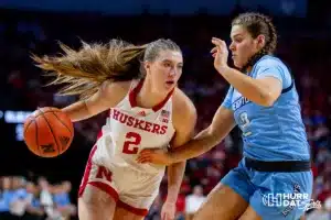 Nebraska Cornhusker guard Logan Nissley (2) drives to the basket against Creighton Bluejay guard Kennedy Townsend (2) in the third quarter during the basketball game on Sunday, November 19, 2023, in Lincoln, Nebraska. Photo by John S. Peterson.