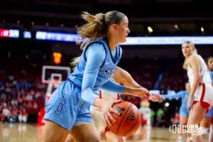 Nebraska Cornhusker guard Callin Hake (14) drives the baseline for a layup against Nebraska Cornhusker guard Jaz Shelley (1) in the second quarter during the basketball game on Sunday, November 19, 2023, in Lincoln, Nebraska. Photo by John S. Peterson.