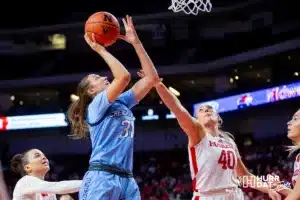 Creighton Bluejay forward Emma Ronsiek (31) makes a layup against Nebraska Cornhusker center Alexis Markowski (40) in the second quarter during the basketball game on Sunday, November 19, 2023, in Lincoln, Nebraska. Photo by John S. Peterson.