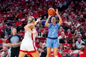 Creighton Bluejay forward Emma Ronsiek (31) makesa. three point shot against Nebraska Cornhusker center Alexis Markowski (40) in the second quarter during the basketball game on Sunday, November 19, 2023, in Lincoln, Nebraska. Photo by John S. Peterson.