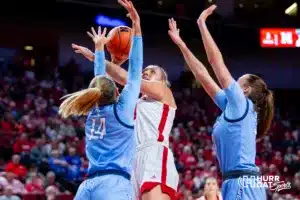 Nebraska Cornhusker center Alexis Markowski (40) makes a layup against Creighton Bluejay forward Mallory Brake (14) and forward Emma Ronsiek (31) in the first quarter during the basketball game on Sunday, November 19, 2023, in Lincoln, Nebraska. Photo by John S. Peterson.