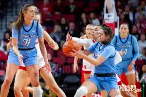 Nebraska Cornhusker guard Darian White (0) knocks the ball away from Creighton Bluejay guard Lauren Jensen (15) in the first quarter during the basketball game on Sunday, November 19, 2023, in Lincoln, Nebraska. Photo by John S. Peterson.
