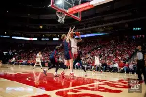 Nebraska Cornhusker guard Brice Williams (3) makes a basket against Duquesne Duke forward Jakub Necas (7) in the second half during the college basketball game on Wednesday November 22, 2023, in Lincoln, Neb. Photo by John S. Peterson.