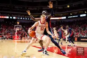 Nebraska Cornhusker forward Rienk Mast (51) drives into Duquesne Duke forward Halil Barre (5) in the second half during the college basketball game on Wednesday November 22, 2023, in Lincoln, Neb. Photo by John S. Peterson.