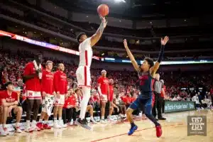 Nebraska Cornhusker guard Jamarques Lawrence (10) makes a three point shot against Duquesne Duke guard Kailon Nicholls (55) in the second half during the college basketball game on Wednesday November 22, 2023, in Lincoln, Neb. Photo by John S. Peterson.