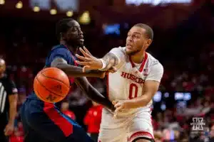 Nebraska Cornhusker guard C.J. Wilcher (0) makes a pass against the Duquesne Dukes in the first half during the college basketball game on Wednesday November 22, 2023, in Lincoln, Neb. Photo by John S. Peterson.