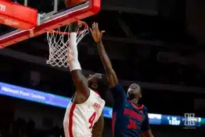 Nebraska Cornhusker forward Juwan Gary (4) makes a basket against Duquesne Duke forward Fousseyni Drame (34) in the first half during the college basketball game on Wednesday November 22, 2023, in Lincoln, Neb. Photo by John S. Peterson.