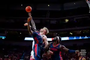 Nebraska Cornhusker forward Rienk Mast (51) fights for a rebound against Duquesne Duke forward Fousseyni Drame (34) in the second half during the college basketball game on Wednesday November 22, 2023, in Lincoln, Neb. Photo by John S. Peterson.