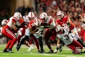 Nebraska Cornhuskers defense tackles Wisconsin Badgers running back Jackson Acker