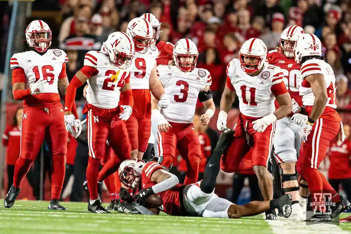 Nebraska Cornhuskers defense stands over Wisconsin Badgers running back Jackson Acker 