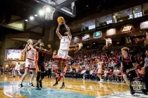 Nebraska Cornhusker guard Brice Williams (3) makes a layup against Oregon State Beaver guard Justin Rochelin (5) in the second half during the basketball game on Saturday, November 18, 2023, in Sioux Falls, South Dakota. Photo by John S. Peterson.