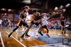 Nebraska Cornhusker forward Juwan Gary (4) goes for the ball against Oregon State Beaver forward Thomas Ndong (22) in the second half during the basketball game on Saturday, November 18, 2023, in Sioux Falls, South Dakota. Photo by John S. Peterson.