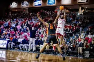 Nebraska Cornhusker guard Brice Williams (3) makes a three against Oregon State Beaver forward Thomas Ndong (22) in the first half during the basketball game on Saturday, November 18, 2023, in Sioux Falls, South Dakota. Photo by John S. Peterson.
