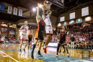 Nebraska Cornhusker guard Brice Williams (3) makes a layup against Oregon State Beaver forward Tyler Bilodeau (34) in the first half during the basketball game on Saturday, November 18, 2023, in Sioux Falls, South Dakota. Photo by John S. Peterson.