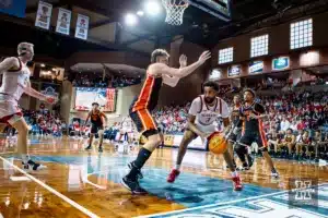 Nebraska Cornhusker guard Brice Williams (3) drives to the basket agaisnt Oregon State Beaver forward Tyler Bilodeau (34) in the first half during the basketball game on Saturday, November 18, 2023, in Sioux Falls, South Dakota. Photo by John S. Peterson.