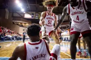 Nebraska Cornhusker forward Josiah Allick (53) helps guard Jamarques Lawrence (10) up in the first half  during the basketball game on Saturday, November 18, 2023, in Sioux Falls, South Dakota. Photo by John S. Peterson.