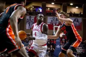 Nebraska Cornhusker forward Juwan Gary (4) drives to the basket against Oregon State Beaver forward Tyler Bilodeau (34) and guard Dexter Akanno (4) in the first half during the basketball game on Saturday, November 18, 2023, in Sioux Falls, South Dakota. Photo by John S. Peterson.