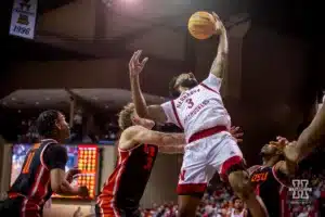 Nebraska Cornhusker guard Brice Williams (3) grabs the rebound against Oregon State Beaver forward Tyler Bilodeau (34) and guard Dexter Akanno (4) inteh first half during the basketball game on Saturday, November 18, 2023, in Sioux Falls, South Dakota. Photo by John S. Peterson.