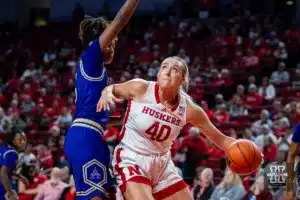 Nebraska Cornhusker center Alexis Markowski (40) drives in to Alcorn State Lady Brave forward Destiny Brown (5) for a layup in the second half during the basketball game on Tuesday, November 14, 2023, in Lincoln, Nebraska. Photo by John S. Peterson.