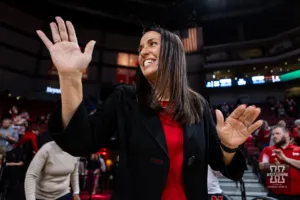 Nebraska Cornhusker head coach Amy Williams waves to the fans coming out on the court during the basketball game against the Alcorn State Lady Braves on Tuesday, November 14, 2023, in Lincoln, Nebraska. Photo by John S. Peterson.